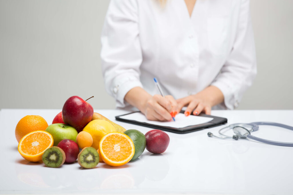 nutritionist noting healthy fruits